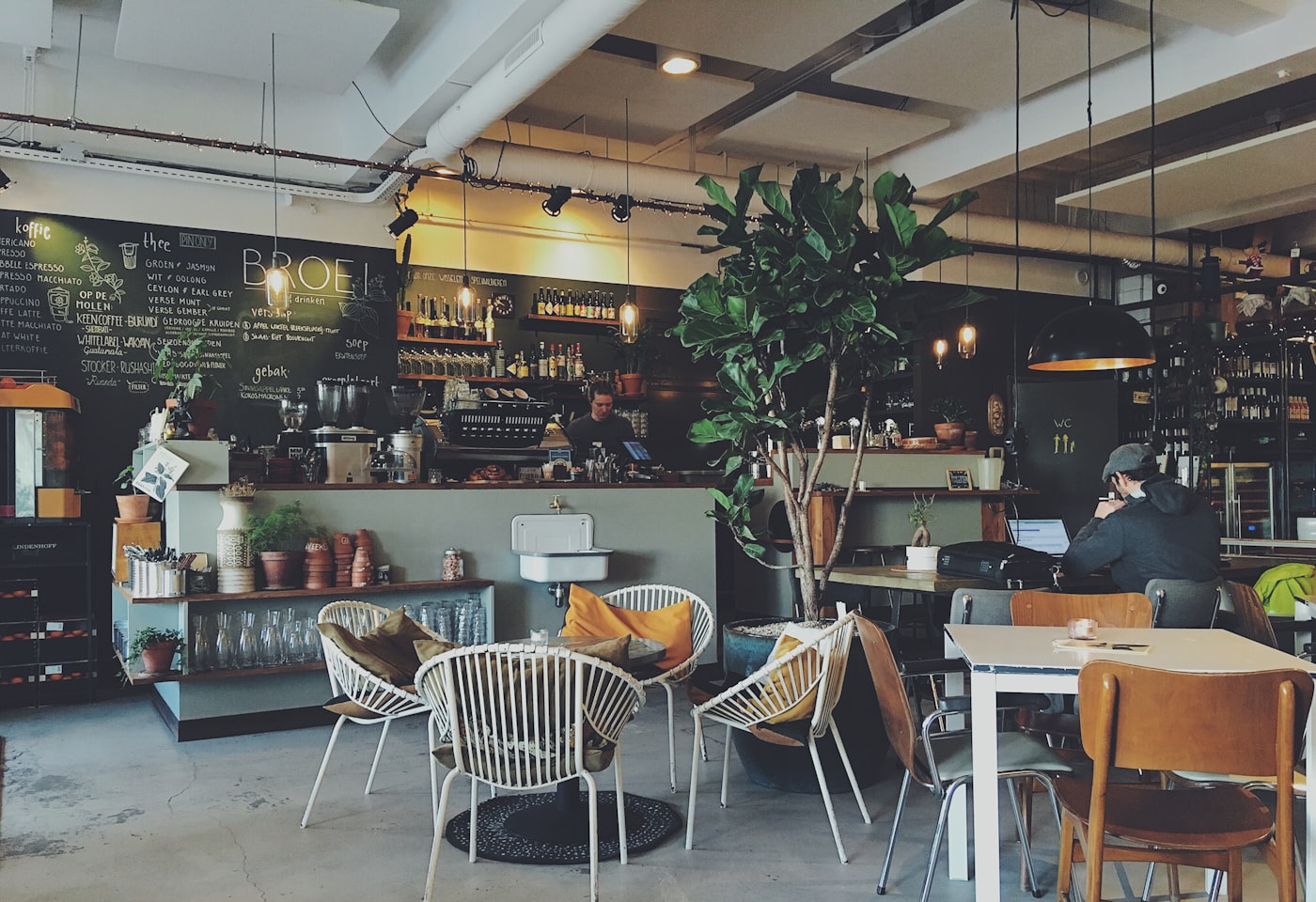 Customers relaxing inside a local cafe